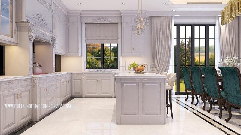 Không gian phòng bếp biệt thự được sử dụng khá nhiều các cột tròn với chi tiết chạm khắc nhẹ nhàng là một trong những đặc điểm điển hình của phong cách thiết kế nội thất tân cổ điển