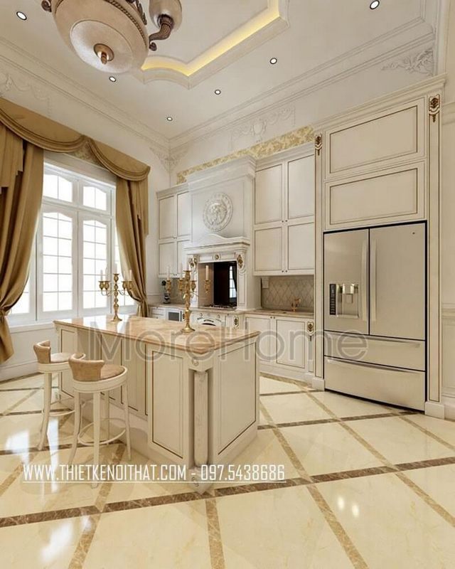 Thiết kế nội thất bếp sang trọng với hệ thống tủ bếp màu trắng đường nét tân cổ điển trang trí tỉ mỉ, tinh tế
