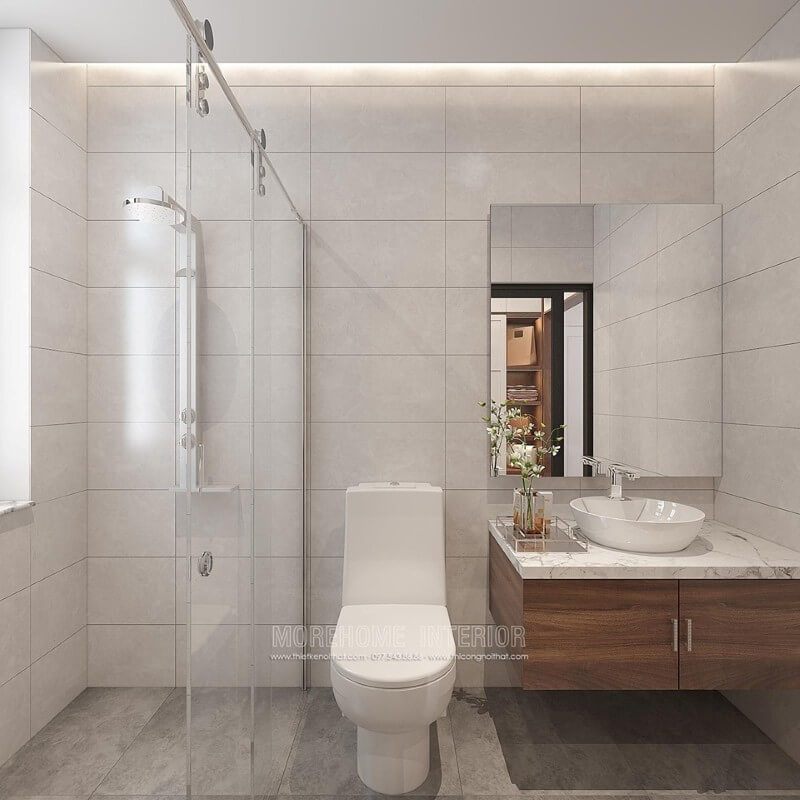 Có thể mẫu thiết kế phòng tắm nhỏ đẹp trên đây sẽ là gợi ý thú vị với cách bố trí khoa học, phòng tắm kính cửa trượt giúp căn phòng trở nên thông thoáng, gạch ốp tường từ đá giả màu bê tông.